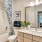 a bathroom with a tub sink and toilet
