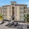 a parking lot in front of a large building